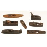 A collection of 7 small primitive hardwood planes 4 1/2" to 7" long G