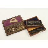 Two sets of brass drawing instruments in leather and mahogany cases G