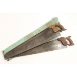 Two saws in a canvas case by SKINNER and ROWBOTHAM farmers saw