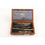 A brass and ivory set of drawing instruments by HARLING in mahogany case G