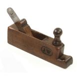 An 18c French fruitwood hollow plane 8 1/2" x 1 1/4" with front tote and scrolled wedge,