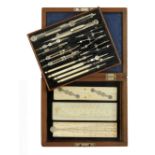 A German silver drawing set by STANLEY London with ivory handled pens and ivory sector,