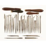 An ornamental turners kit of 26 turning tools and 4 rosewood and brass handles F.