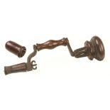 An 18c German Nuremburg style iron brace with fruitwood handle and bulbous head,