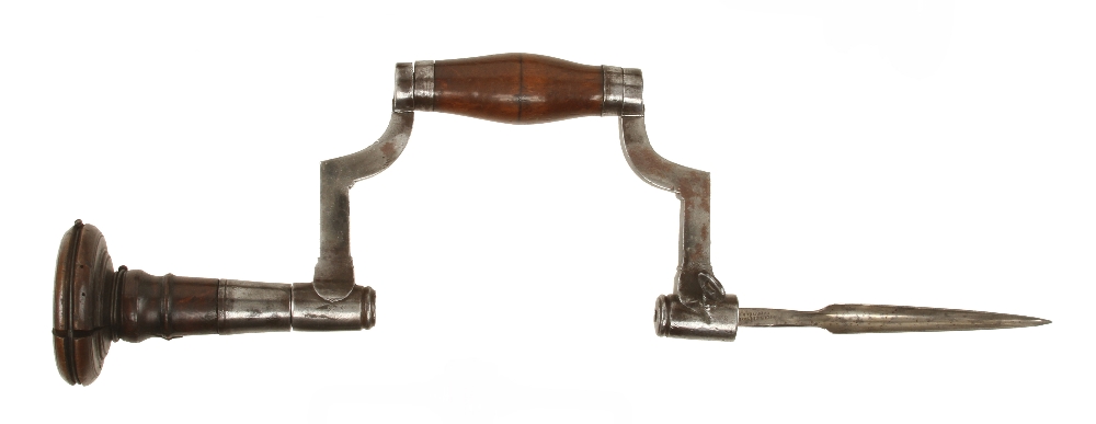 A fine 18c French coopers brace with simple moulded decoration to frame and fruitwood handle and