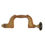 A rare and little used brass plated beech brace by JOSEPH COOPER with unusual pull button pad with