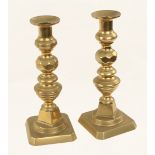 An early pair of 10 1/2" decorative brass candlesticks with candle stub extractor G++