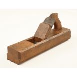 A rare early 13 1/2" x 2 3/4" moulding plane (name unclear) with offset handle and round topped