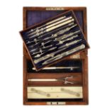 A 13 piece drawing set by HALDEN Manchester with ivory parallel rule and pens beneath in fitted