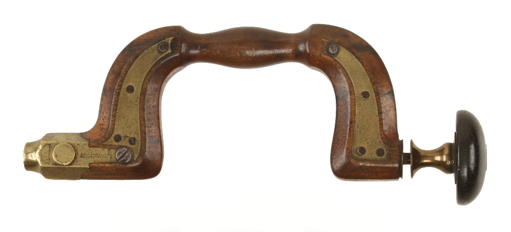 An early brass plated button pad beech brace stamped MARPLES Invention with ebony head,
