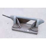 A heavy cast iron mitre trimmer,