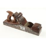 A rare 131/2" iron panel plane by ARCHER with overstuffed rosewood infill and scrolled wedge behind