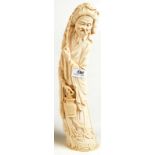 An early 20th century Japanese ivory carving of a bearded fisherman holding a basket in one hand,