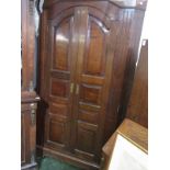 An 18th century oak standing corner cupboard,