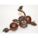 An oriental bronze of a sparrow on a branch above a pair of persimmon and leaves, width 35cm,