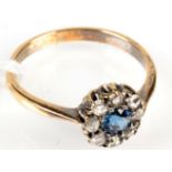 An 18ct. gold diamond and sapphire cluster ring.