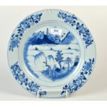 A Chinese 18th century blue and white dish decorated with a river scene,