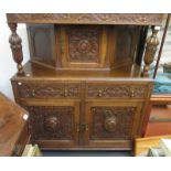 A carved oak, court cupboard, width 122cm.