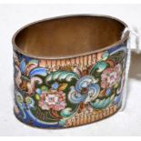 A Russian cloisonne enamelled napkin ring.