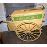 A late Victorian or Edwardian bread cart with spoked 80cm wheels mounted on a sprung axle,