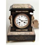 A slate and marble mantle clock with cast gilt lion mask handles, height 28cm.