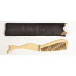 A Victorian bone moustache comb made as a ladies leg with paste stone garter, length 13.