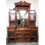 A fine late Victorian walnut mirror backed sideboard, with carved panels, bevelled glass,