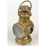 A Powell & Hanmer brass 'Motor Tail' lamp, height including handle 28cm.