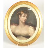 A coloured print of an 18th century girl in an oval gilt frame with floral moulded mounts and bead