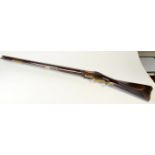 A Baker flintlock rifle. Condition Report: Barrel length 77 cm. Split next to plate, end of wood