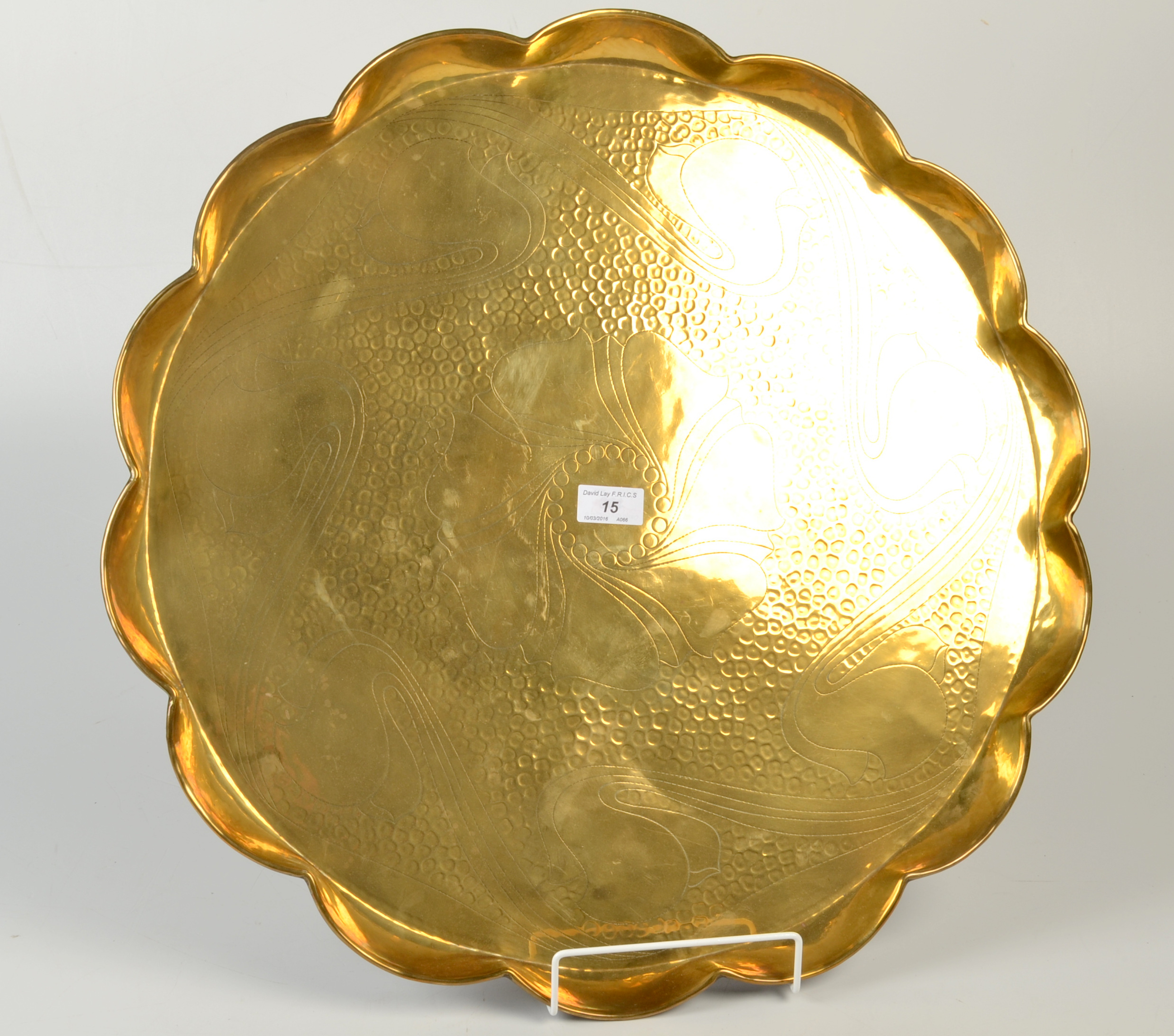A Hayle, J. & F.Pool Arts and Crafts, lobed circular brass tray decorated with stylised flowers. No.