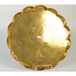 A Hayle, J. & F.Pool Arts and Crafts, lobed circular brass tray decorated with stylised flowers. No.