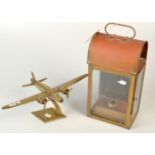 A brass model of a WWII twin engine bomber, wing span 35cm. and a brass companion way lamp.