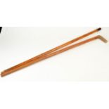 A malacca cane and a walking cane with pipe bowl finial.