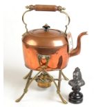 A serpentine lighthouse table lamp, a copper spirit kettle,