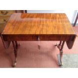 A rare Regency crossbanded mahogany sofa table of small proportions with ebony inlay on turned