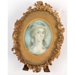 A portrait miniature in 18th century style with ornate gilt brass rococo frame. Frame height 10cm.