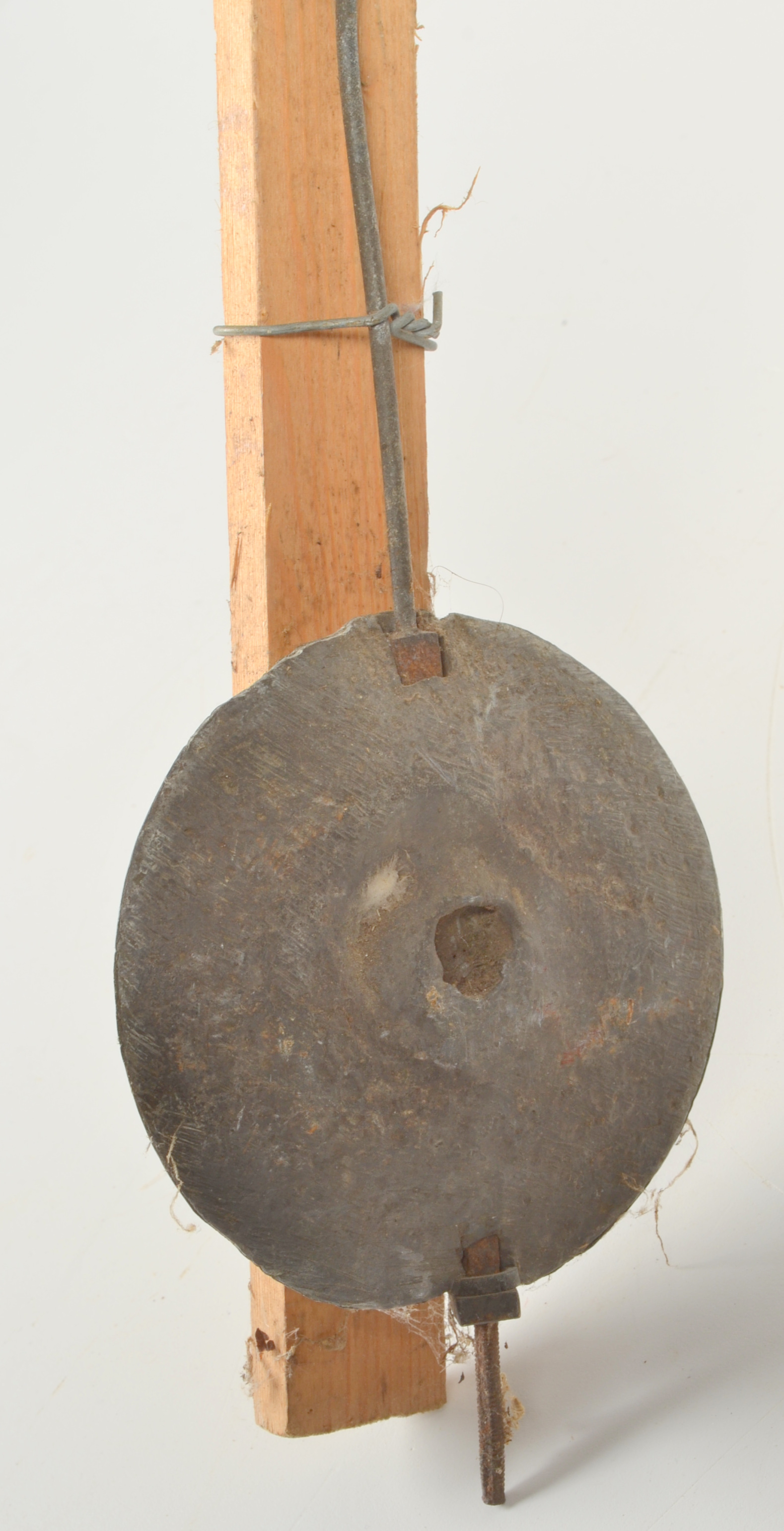 A longcase clock pendulum.