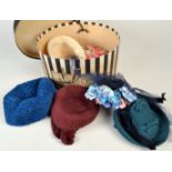 A box of six 20th century hats.