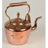 A Victorian copper kettle with a brass acorn finial.