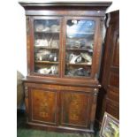 A fine English marquetry bookcase in French taste the upper section with two glazed doors,