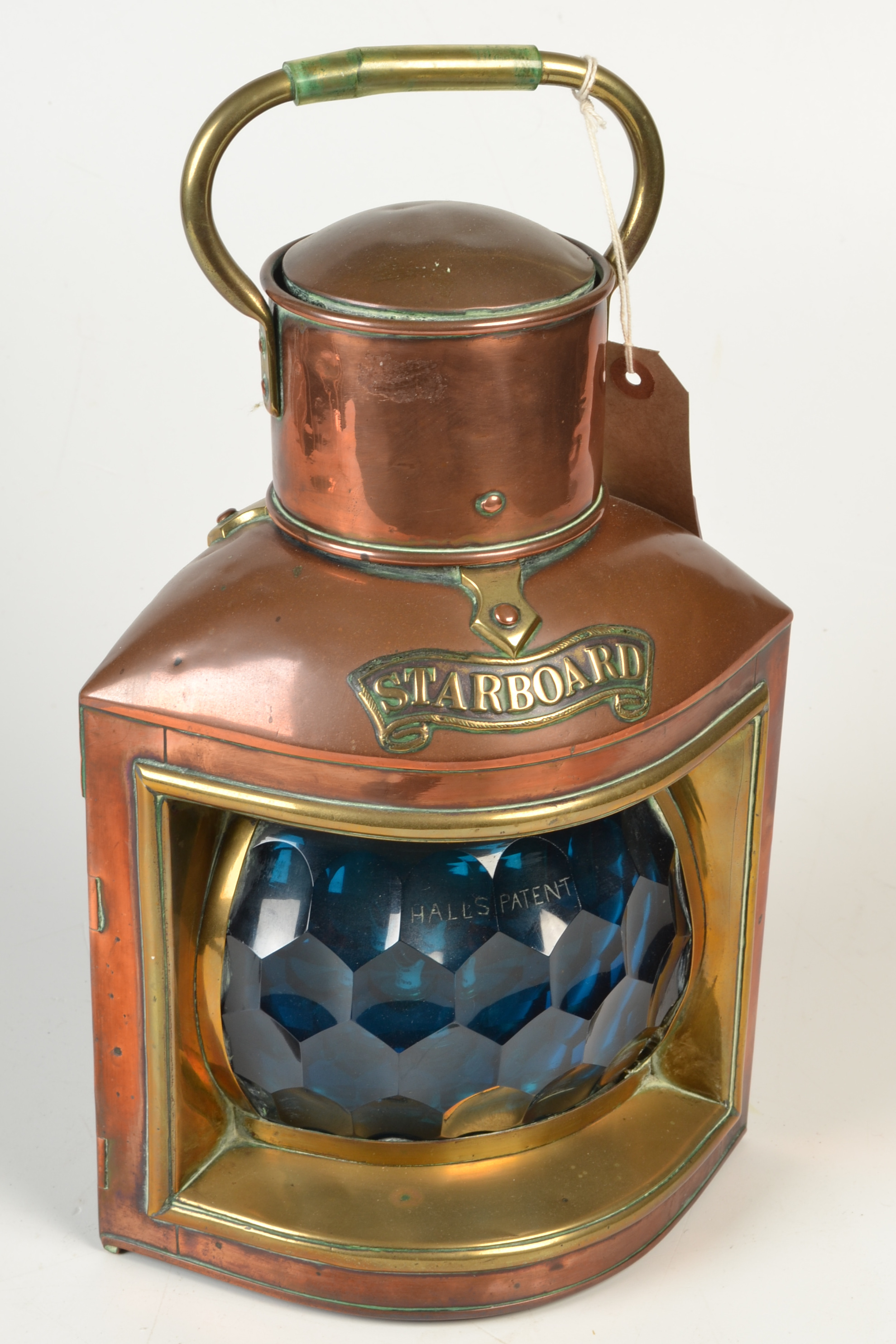 A ship's copper and brass 'Starboard' navigation lamp with burner and reflector and with Hall's