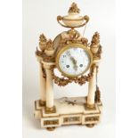 A Louis XVI clock on four columns with chased ormolu mounts, the movement signed Plancho,