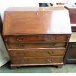 A George III oak, slope front bureau, width 92cm.