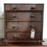 A Victorian miniature chest of four long graduated drawers, 34.5 x 34.5cm.