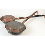 Two copper warming pans.