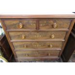 A Victorian mahogany veneered chest of two short and three long graduated cock beaded drawers,