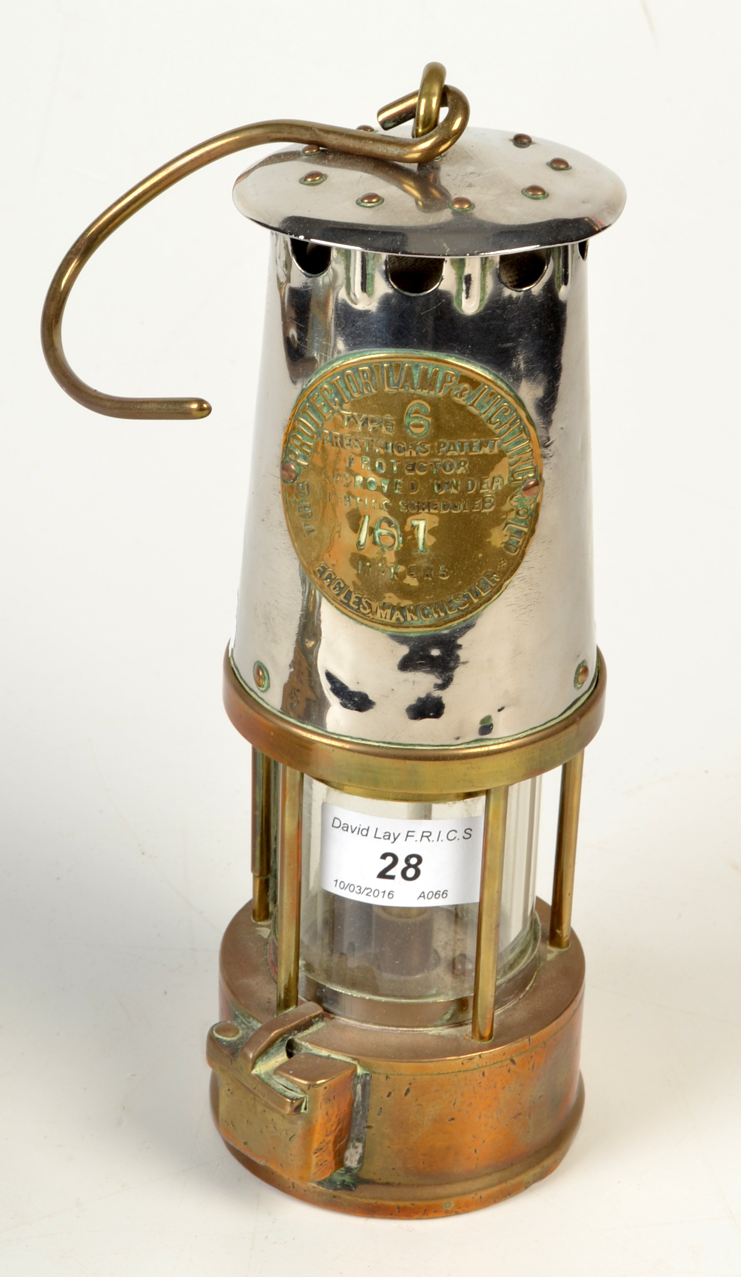 A miner's chrome and brass lamp by The Protector Lamp & Lighting Co. Ltd., height 24cm.