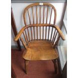 A child's early 19th century stickback Windsor armchair.