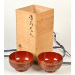 A set of six Japanese wood bowls with a natural wood grain highlighted and the body horizontally